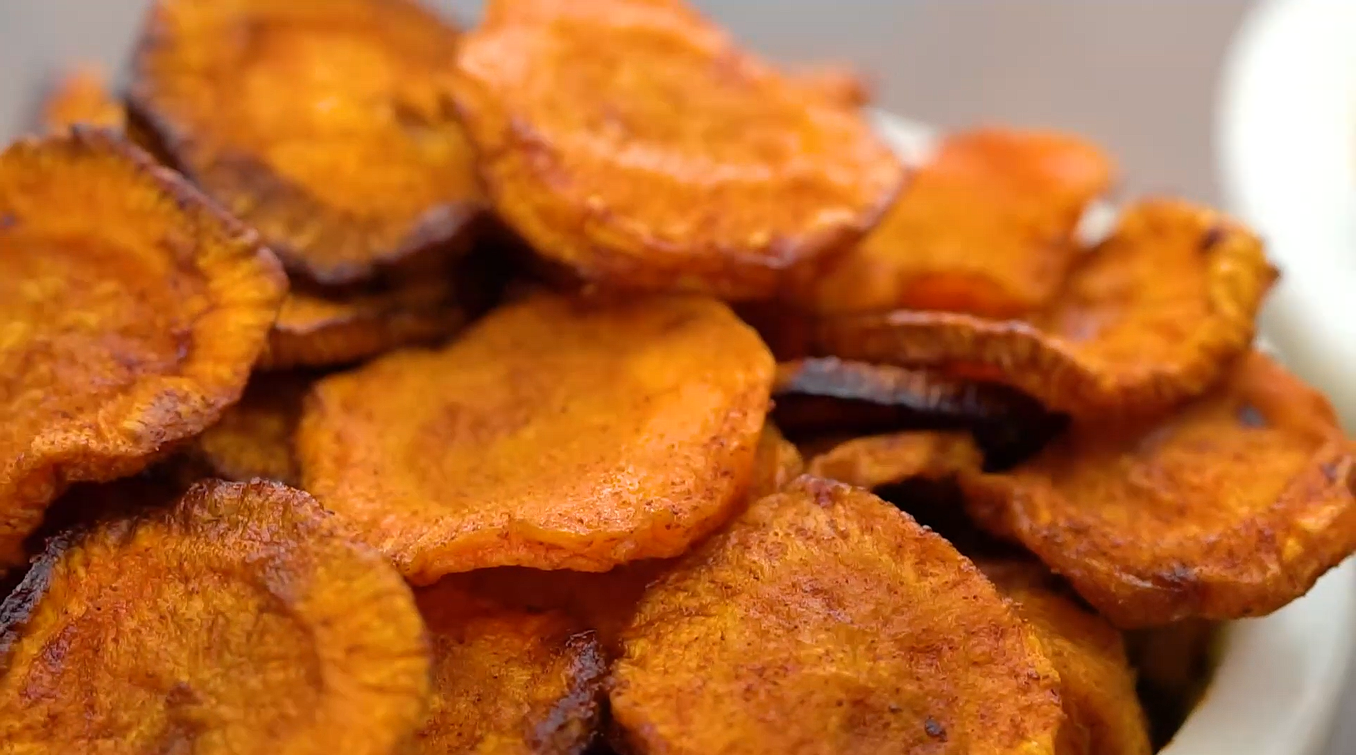 Carrot chips in air fryer on a white plate