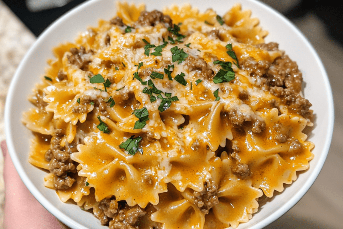 Savory garlic butter beef served with cheesy bowtie pasta, creating a creamy, flavorful dish.