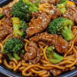 Tender beef and fresh broccoli stir-fried with lo mein noodles in a savory sauce for a quick and delicious meal.