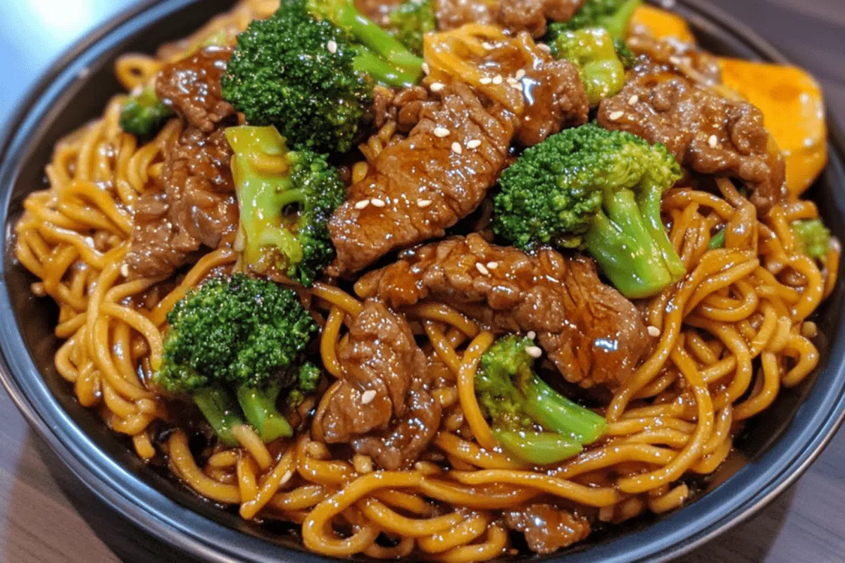 Tender beef and fresh broccoli stir-fried with lo mein noodles in a savory sauce for a quick and delicious meal.