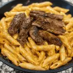 Creamy Cajun Steak & Cheddar Penne Skillet