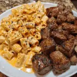 CAJUN STEAK TIPS IN CHEESY RIGATONI PARMESAN SAUCE