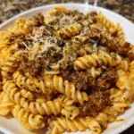 Cheesy Garlic Twisted Pasta with Cajun Ground Beef and Alfredo Velveeta