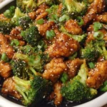 Plate of Honey Sesame Chicken with Broccoli garnished and ready to serve