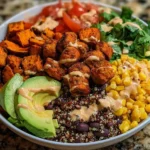 Healthy sweet potato burger bowl with fresh vegetables and toppings
