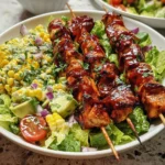 Delicious BBQ chicken skewer salad with fresh vegetables and dressing