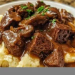 Tender beef tips simmered in rich gravy served over mashed potatoes