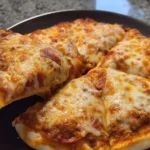 Delicious easy homemade pizza topped with fresh vegetables and cheese