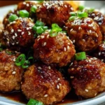 Honey garlic turkey meatballs served on a plate with sauce
