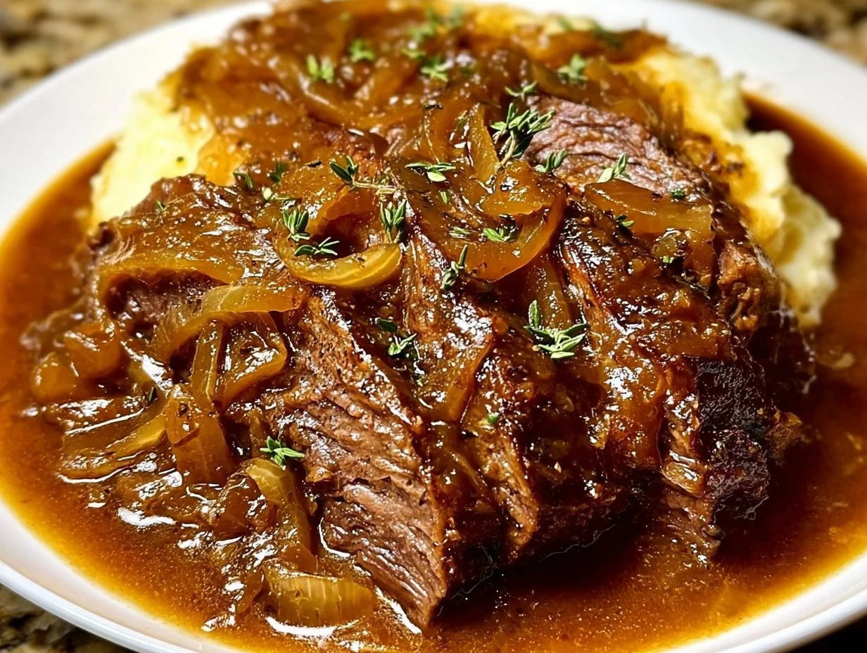 Juicy French onion pot roast served with herbs and vegetables