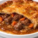 Traditional Irish Steak Pie with flaky pastry and savory beef filling