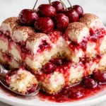 Delicious Cherry Amaretto Tiramisu dessert topped with cherries and amaretto flavor.