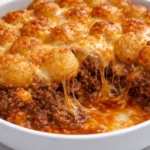 Delicious Chili Cheese Tater Tot Casserole with melted cheese and robust chili
