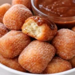 Crispy air fryer churro bites served on a plate with dipping chocolate
