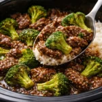Crockpot Beef and Broccoli dish served in a bowl with rice.