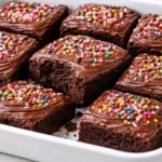 Fudgy Brownie Delight with Chocolate Frosting on a white plate