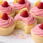 Lemon cupcakes with raspberry buttercream frosting on a decorative plate