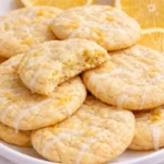 Freshly baked lemon sugar cookies on a white plate