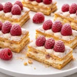 Raspberry Cream Napoleons dessert with layers of cream and fresh raspberries