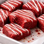 Delicious red velvet brownies topped with cream cheese frosting.