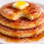 Delicious Spanish churro-inspired pancakes served with chocolate sauce