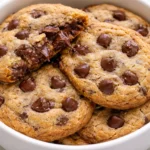 Freshly baked ultimate choc chip cookies on a cooling rack