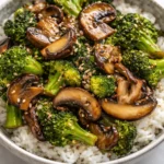 Vegan broccoli and mushroom stir fry in a vibrant, colorful dish.