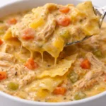 Delicious Chicken Ranch Lasagna Soup garnished with herbs and cheese