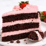 Homemade dark chocolate cake decorated with strawberry buttercream frosting