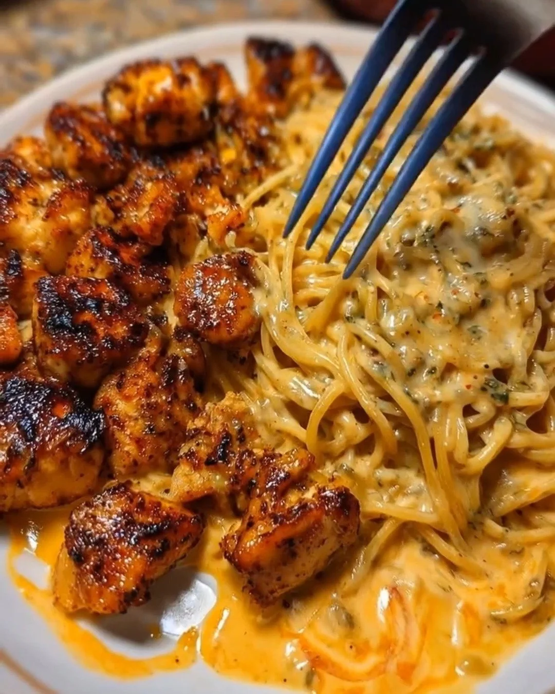 Creamy Cajun garlic chicken spaghetti served in a bowl for dinner.
