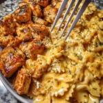 Creamy Garlic Butter Chicken served with bowtie pasta, a delicious family dinner dish.