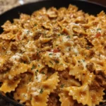 Easy beefy cheesy bowtie skillet with ground beef on a plate