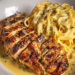 Delicious Cajun Garlic Chicken Linguine topped with Mozzarella Alfredo sauce