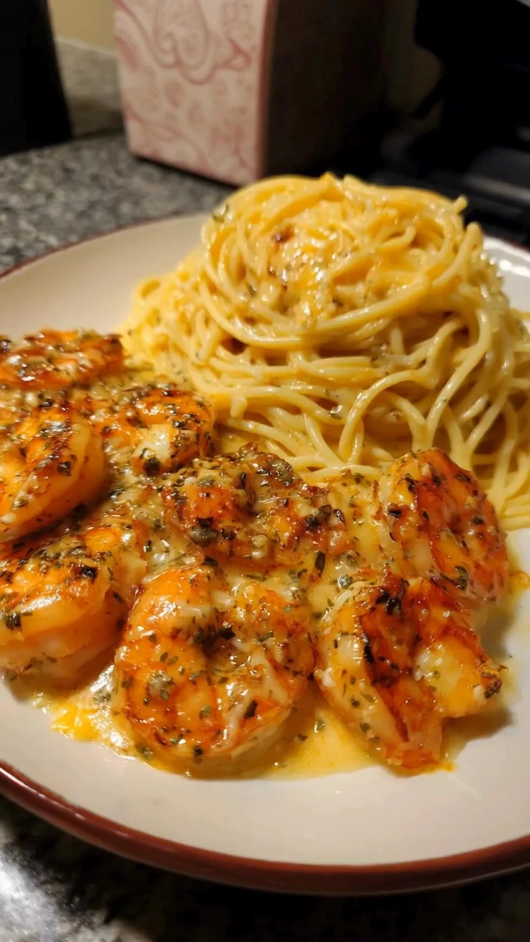 Creamy garlic shrimp spaghetti served in a bowl for a family dinner.