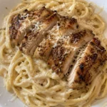 Creamy Garlic Parmesan Chicken Alfredo dish garnished with parsley