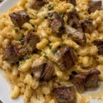 Garlic Butter Steak Bites served with creamy mac and cheese