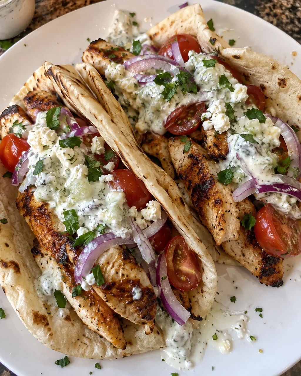 Mediterranean chicken gyros served with creamy feta-tzatziki sauce