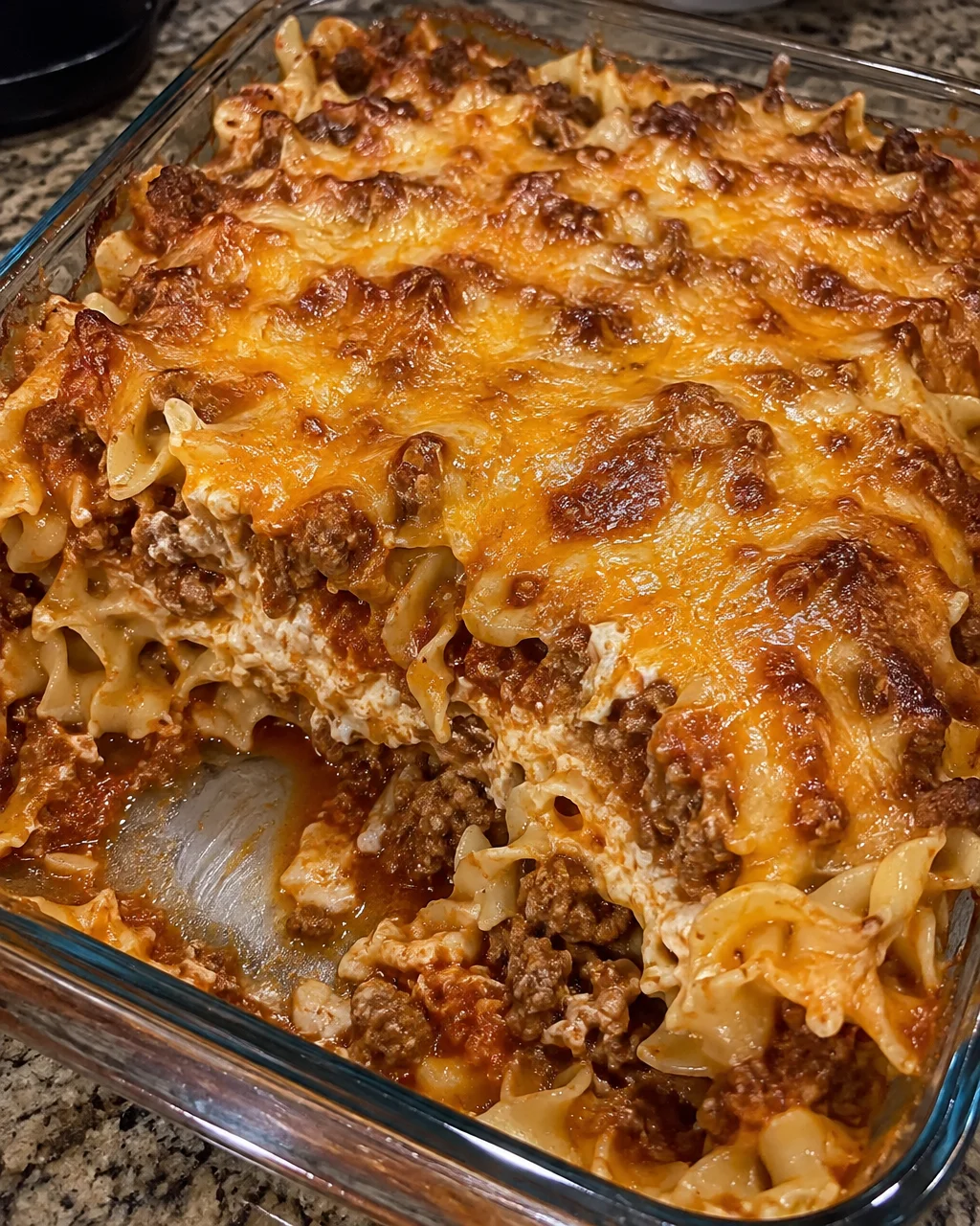 Delicious Poor Man's Husband Casserole with beef, cheese, and noodles.